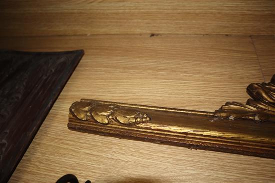 An Italian carved walnut panel, a giltwood frieze and a brass wall rack